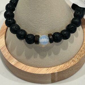 OSHENA Black Lava Bead Bracelet with Iridescent Center Stone